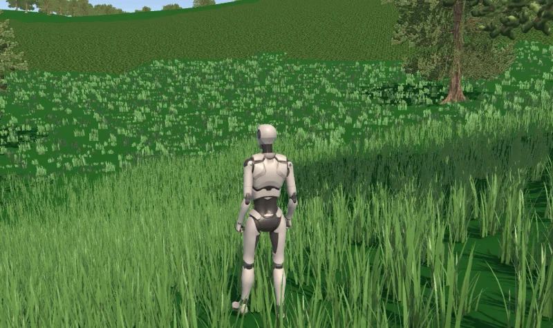 A grey test mannequin in a dense green field of grass with trees along the edge.
