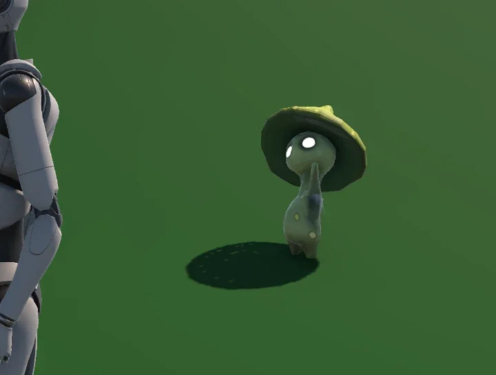 The green Spirit Guide raising one arm beside a grey test mannequin in a simple Unity scene.